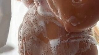 MILF showers and soaps up her curves and squishy body