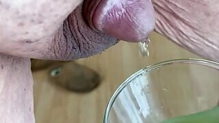 Micro penis pees into glass vase