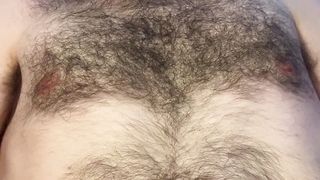 Underside view of bald bearded guy laying down, teasing ass and balls, and masturbating with both hands to a cumshot