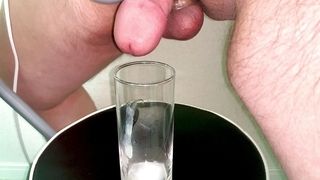 Small Penis Masturbating With A Hand Massager And Cumming In A Glass