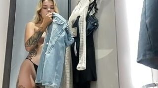 A BLONDE IN THE DRESSING ROOM FILMING HERSELF WHILE NO ONE IS WATCHING