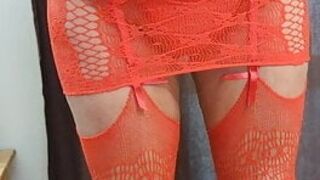 "Red fishnet body suit on my middle aged body."