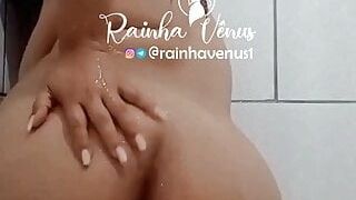 Venus shows off in the shower with her neighbor waiting in the living room